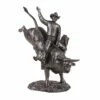 Cowboy Riding Bull Statue
